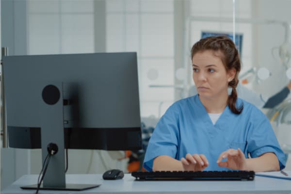 Dental staff member using a computer